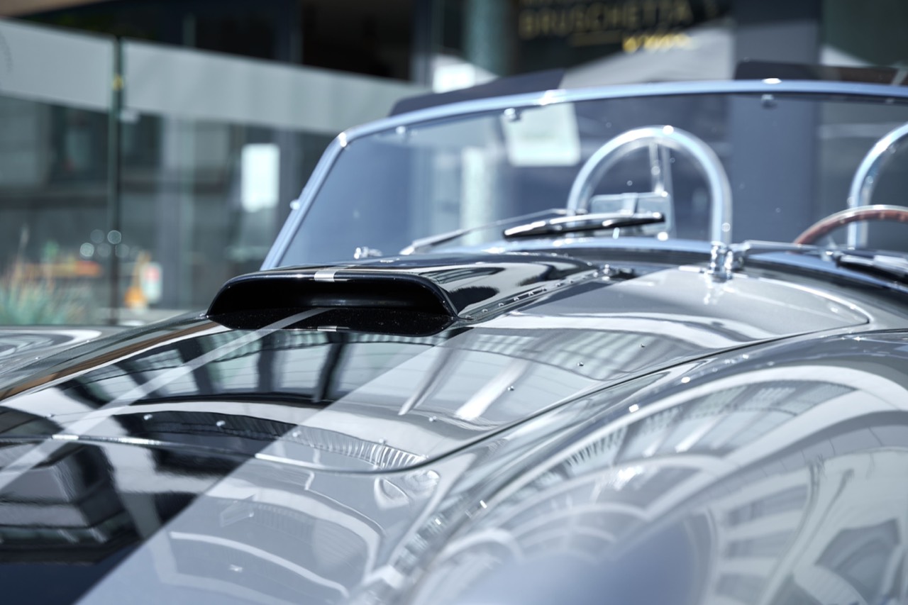 A glossy detailed car reflecting its surroundings